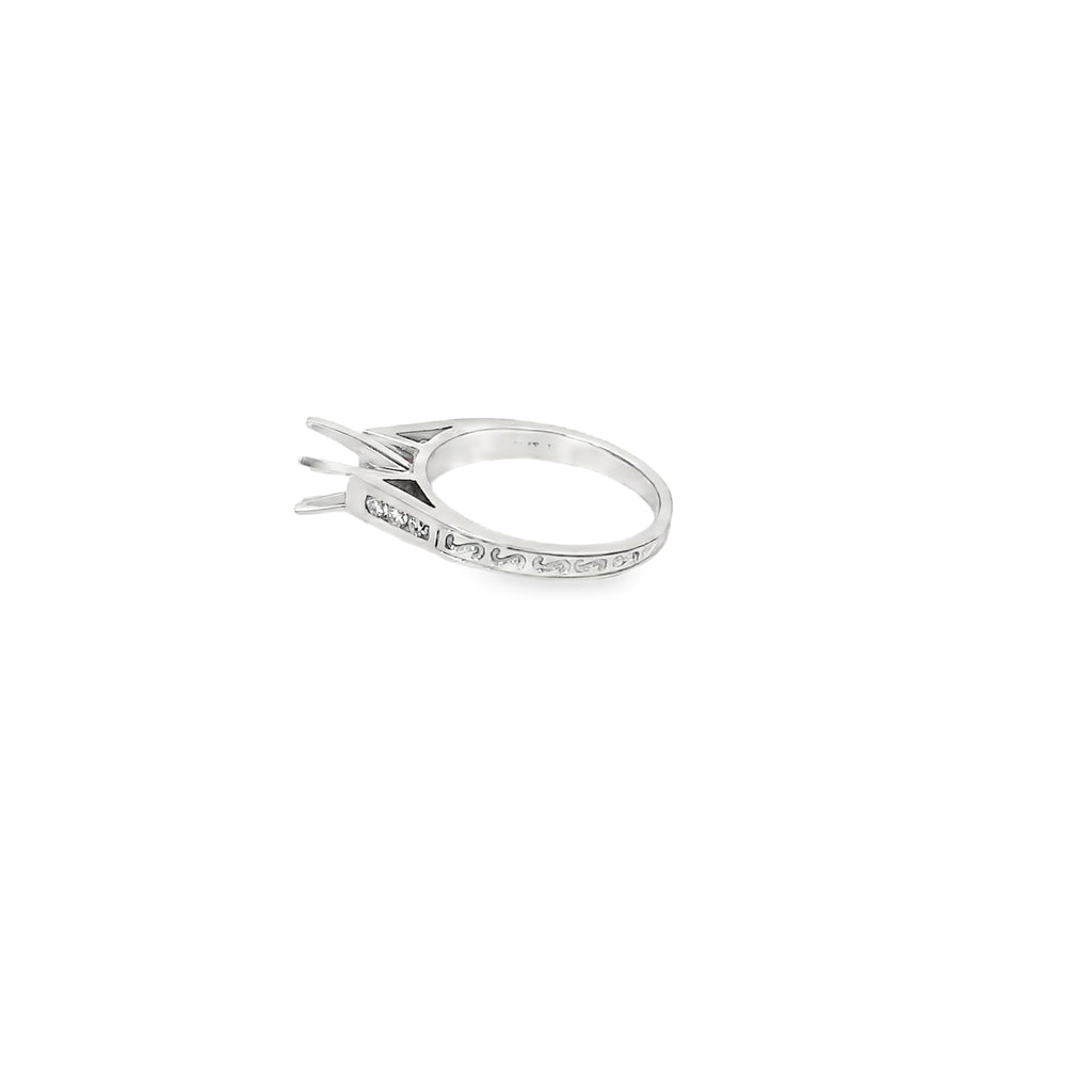 Platinum Engagement Ring with Channel Set Diamonds and an Engraved Design