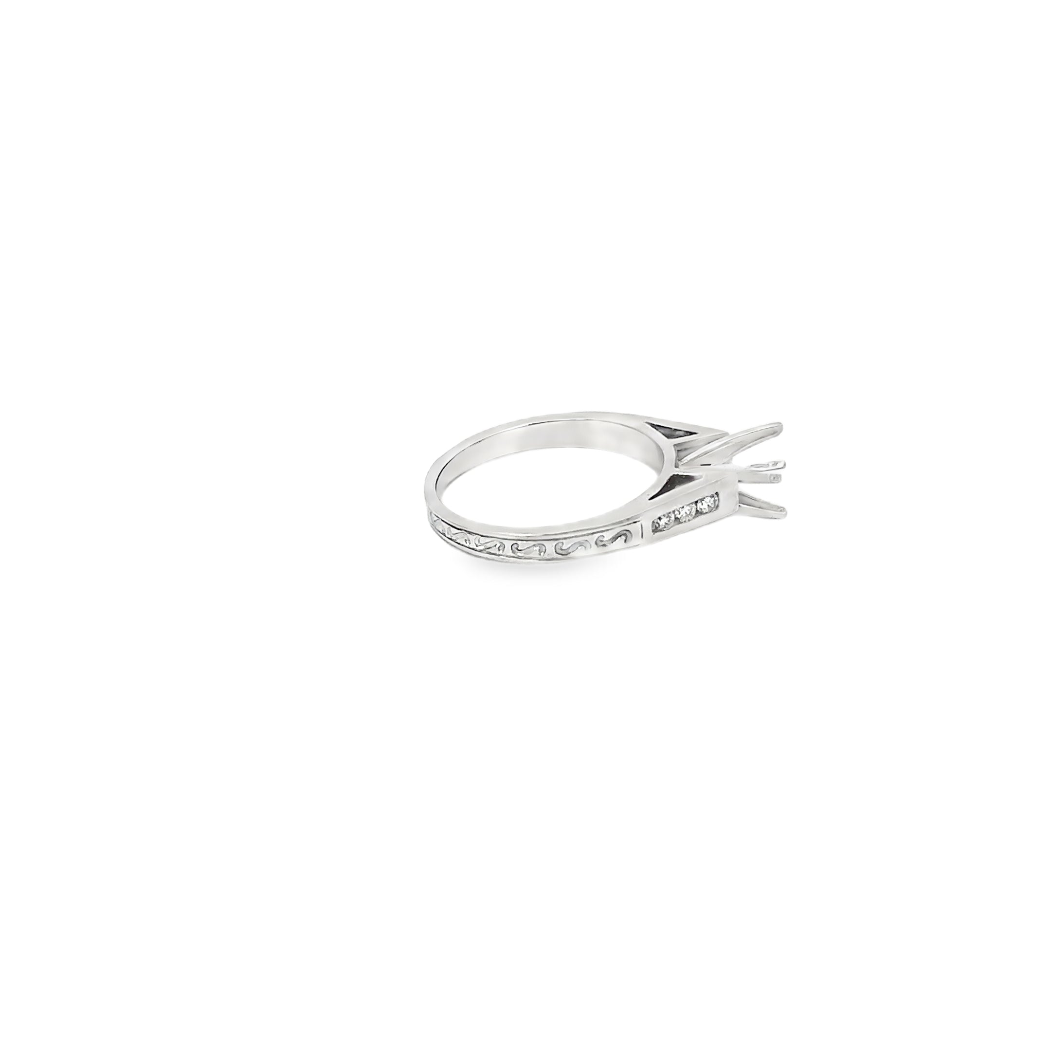 Platinum Engagement Ring with Channel Set Diamonds and an Engraved Design