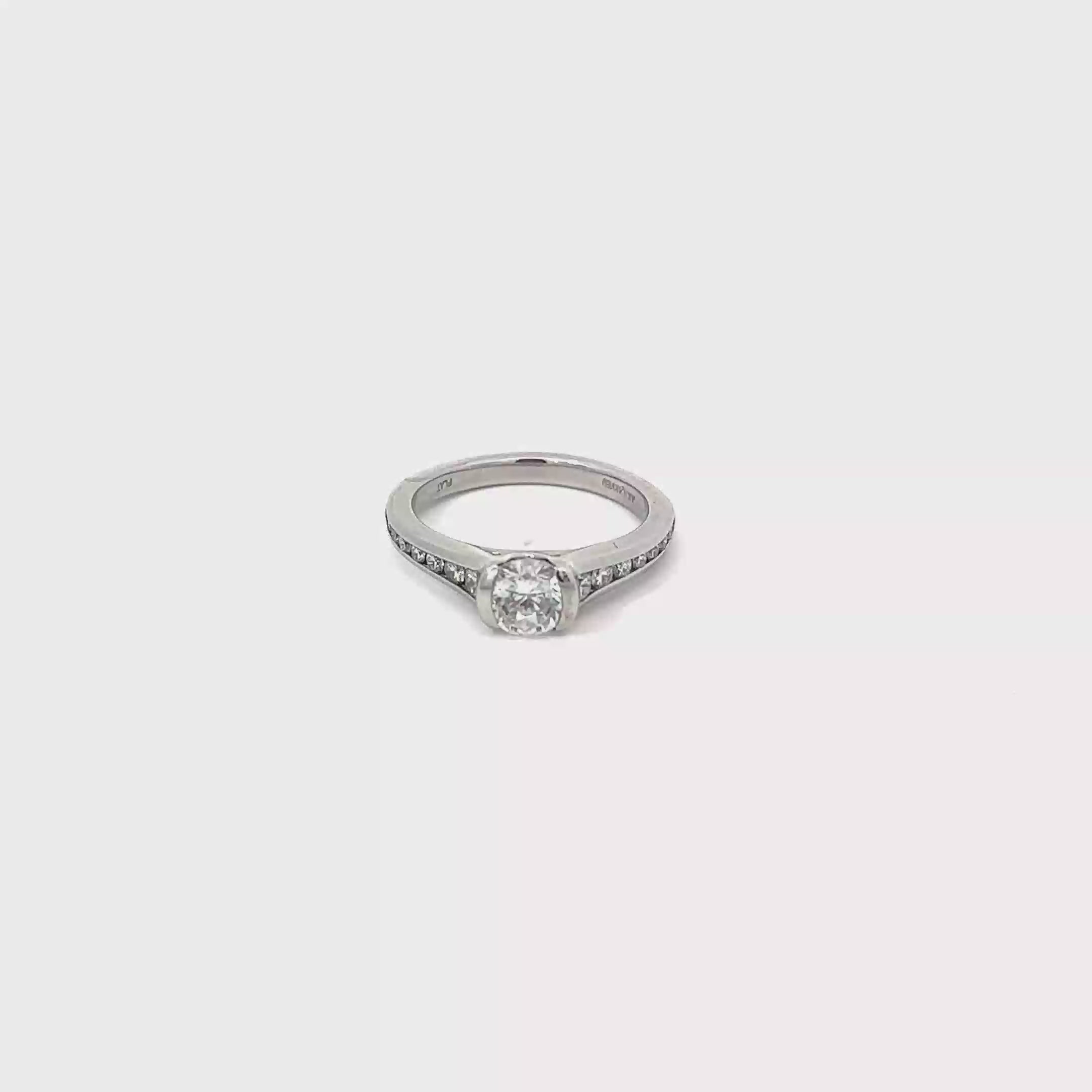 Platinum Half Bezel Engagement Ring with Channel Set Diamonds