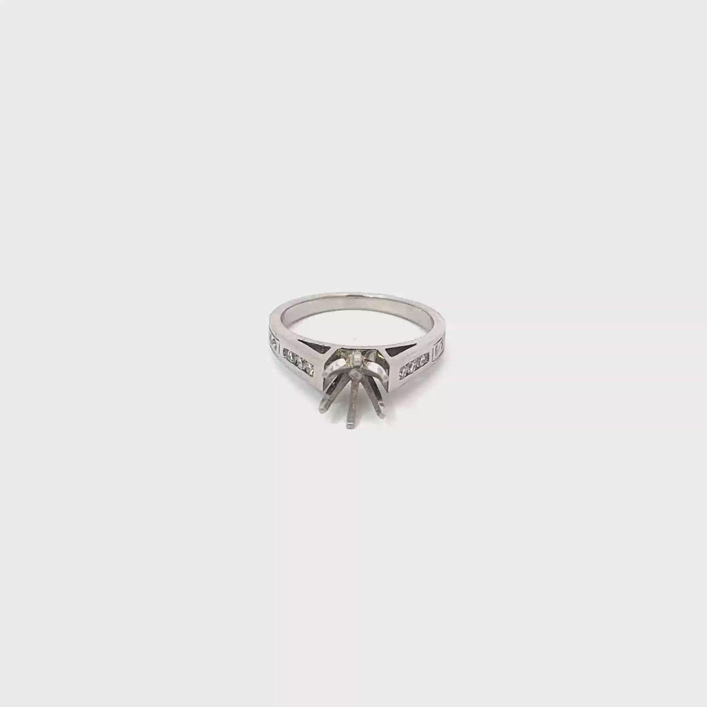 Platinum Engagement Ring with Channel Set Diamonds and an Engraved Design