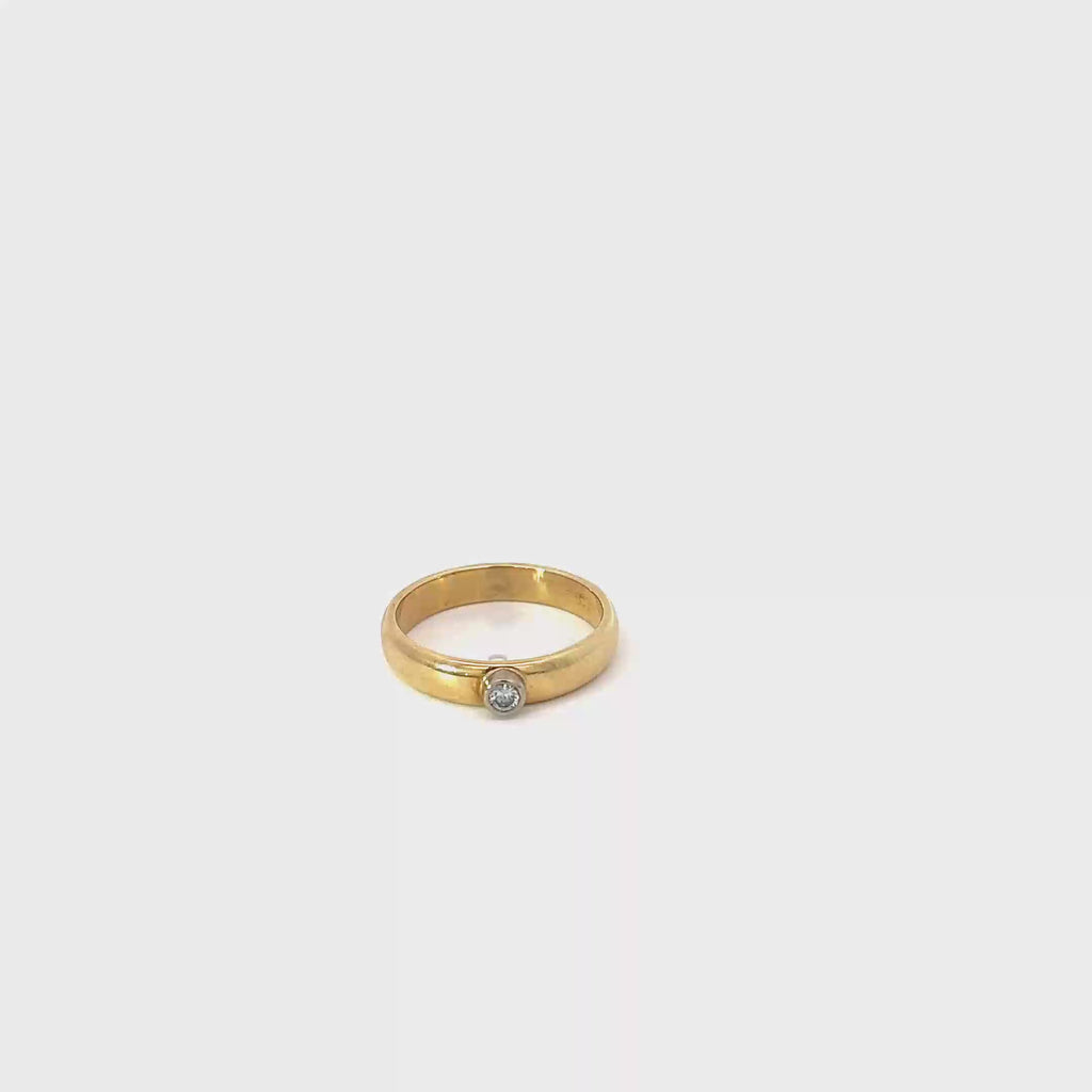 18K Yellow Gold Band with a Round Bezel set Diamond