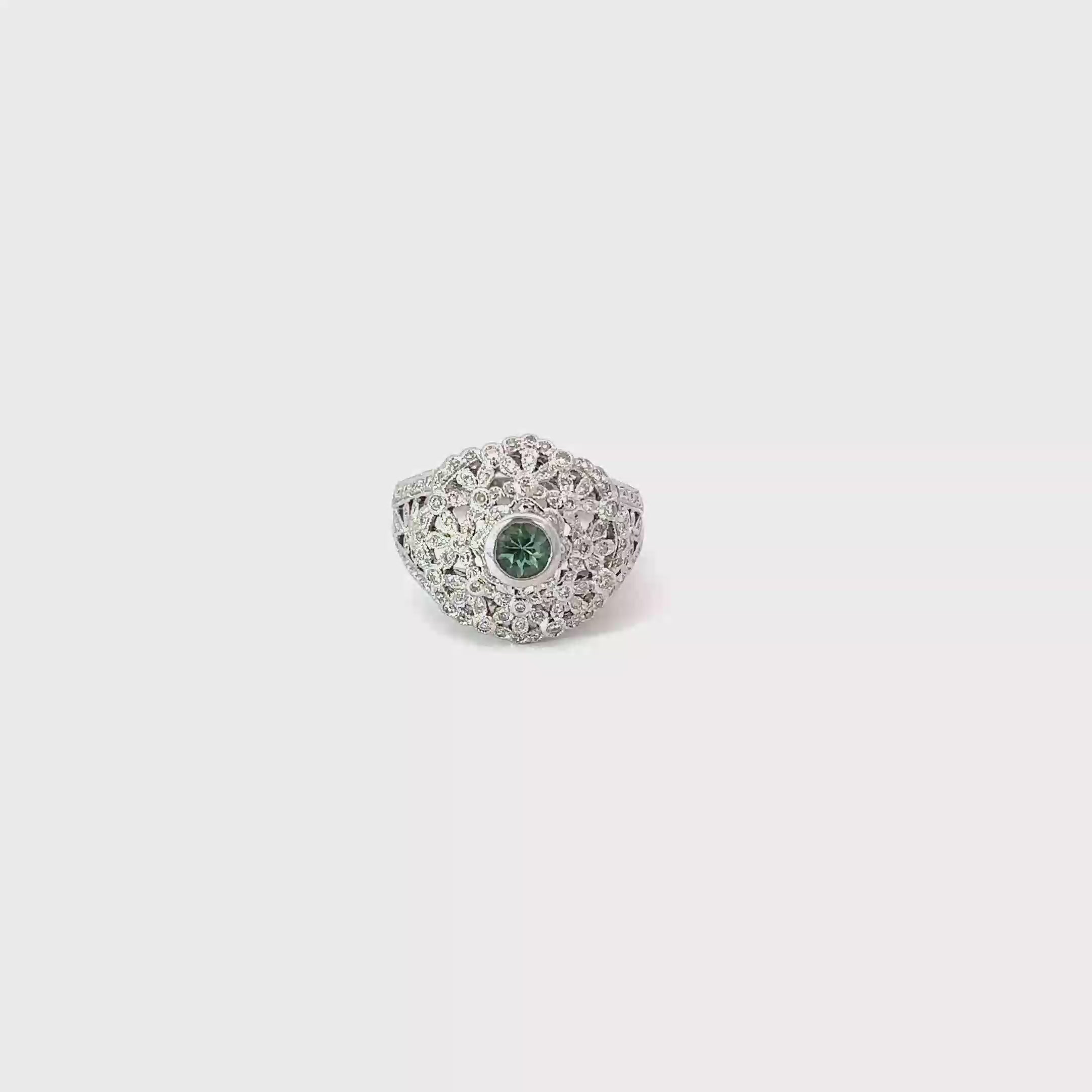 14K White Gold Bezel set round Tsavorite surrounded by Pave Diamonds